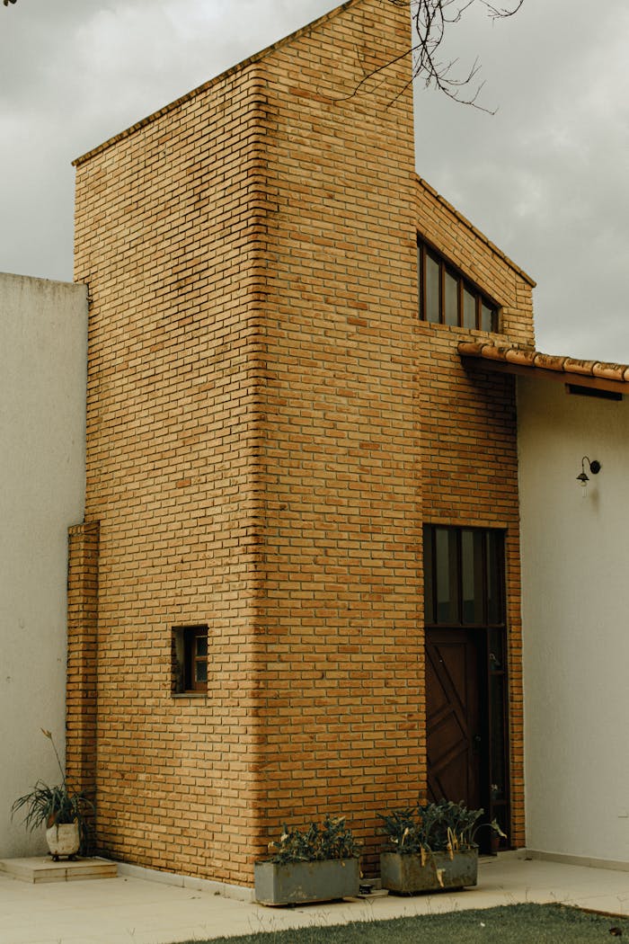 A stylish brick facade emphasizes the modern architectural design of a suburban house.