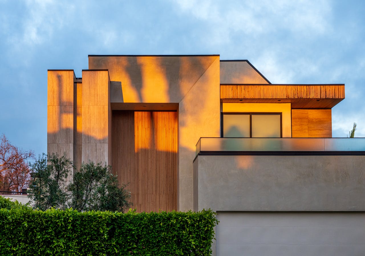 Modern home exterior with warm sunset reflections in West Hollywood, California.